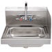 A stainless steel Advance Tabco hand sink with a splash mounted faucet.