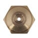 A hexagonal brass orifice with a circular hole in the center.