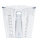 A clear plastic Hamilton Beach blender jar with a ruler on the side.