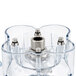 A clear plastic Hamilton Beach blender jar with metal screws.