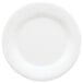 A close-up of a GET Diamond White melamine plate with a white rim.