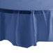 A navy blue Creative Converting OctyRound tablecloth on a table.