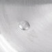 A silver Vollrath Arkadia pan cover with a silver circle in the middle.