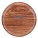 A round java teak Cambro tray with a logo on it.