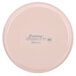 A light peach round Cambro fiberglass tray with a label on it.
