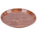 A round Cambro Java Teak fiberglass tray.