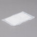 A white rectangular absorbent meat pad.