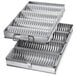 A Chicago Metallic bread pan set with 4 round compartments.