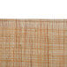A close up of a rectangular woven rattan tray with a white background.