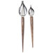A close up of a pair of Zeroll stainless steel deco spoons with beech wood handles.