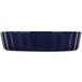 A blue ceramic CAC quiche dish with a fluted rim.