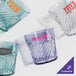 A group of blue GET plastic tumblers with custom text on them.