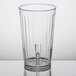 A close-up of a clear GET SAN plastic tumbler.