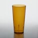 An amber GET plastic tumbler on a table.