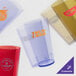 A group of amber GET plastic tumblers.