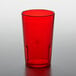 A red plastic GET tumbler on a white table.