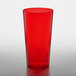 A red GET SAN plastic tumbler on a white surface.