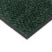 A close-up of a Cactus Mat vibrant sea green Berber carpet mat with black edges.