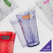 A close-up of a red GET Tahiti plastic tumbler.