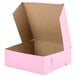 A pink bakery box with the lid open.