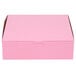 A pink rectangular bakery box with a lid.