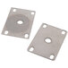 A pair of metal plates with holes.