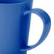 A close up of a Carlisle Ocean Blue Tritan mug with a handle.