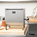 A Weston stainless steel meat mixer with removable paddles.