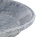 A close-up of a gray and white Cambro fiberglass tray with a swirl design.