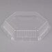 A Genpak clear plastic hexagonal lid on a clear plastic container.