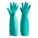 Two pairs of small green San Jamar nitrile gloves.