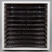 A white rectangular Weston food dehydrator with 10 plastic trays inside.
