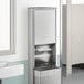 A silver stainless steel rectangular paper towel dispenser and waste receptacle.