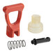 A red and white plastic Bunn faucet repair kit with a spring.