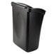 A black plastic Carlisle trash bin with a lid.