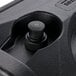 A black plastic vent cap with a button on it.