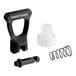 A Bunn faucet repair kit with black and white plastic pieces and a metal spring.