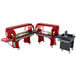 A buffet food cart with food on it and a red Cambro Versa Salad Bar on wheels.