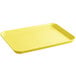 A yellow rectangular Cambro market tray with a handle.