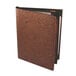 A brown cork folder with black covers.