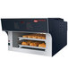 A Hatco Flav-R-Savor heated air curtain holding bread in a bakery display.