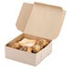 A Kraft bakery box filled with pastries.