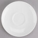 A Tuxton Modena AlumaTux Pearl White china saucer with a small rim on it.