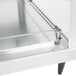 A Hatco stainless steel countertop merchandiser with clear shelves.