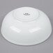 A white Tuxton porcelain bowl.