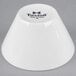 A bright white Tuxton china bouillon cup with black Tuxton text.