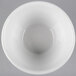 A Tuxton bright white china bouillon bowl with a hole in the middle.