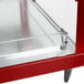 A red and stainless steel Hatco Glo-Ray food warmer with glass doors on a counter.