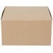 A close-up of a brown Kraft bakery box with a lid.