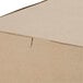 A Kraft bakery box with a lid.